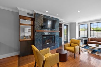 A living room with a fireplace and a television.